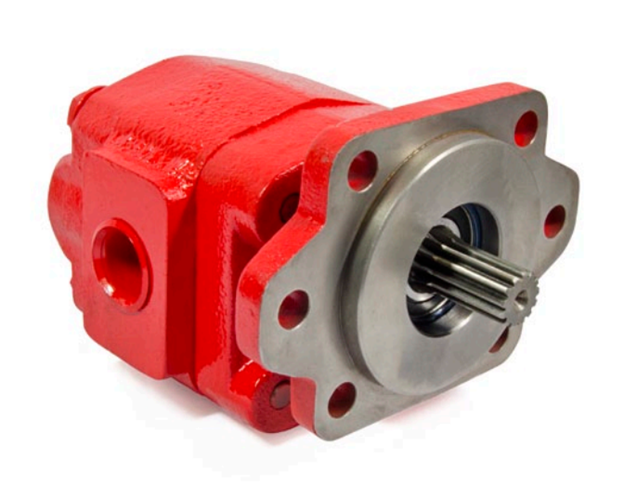 Red hydraulic gear pump with metal connections on white background